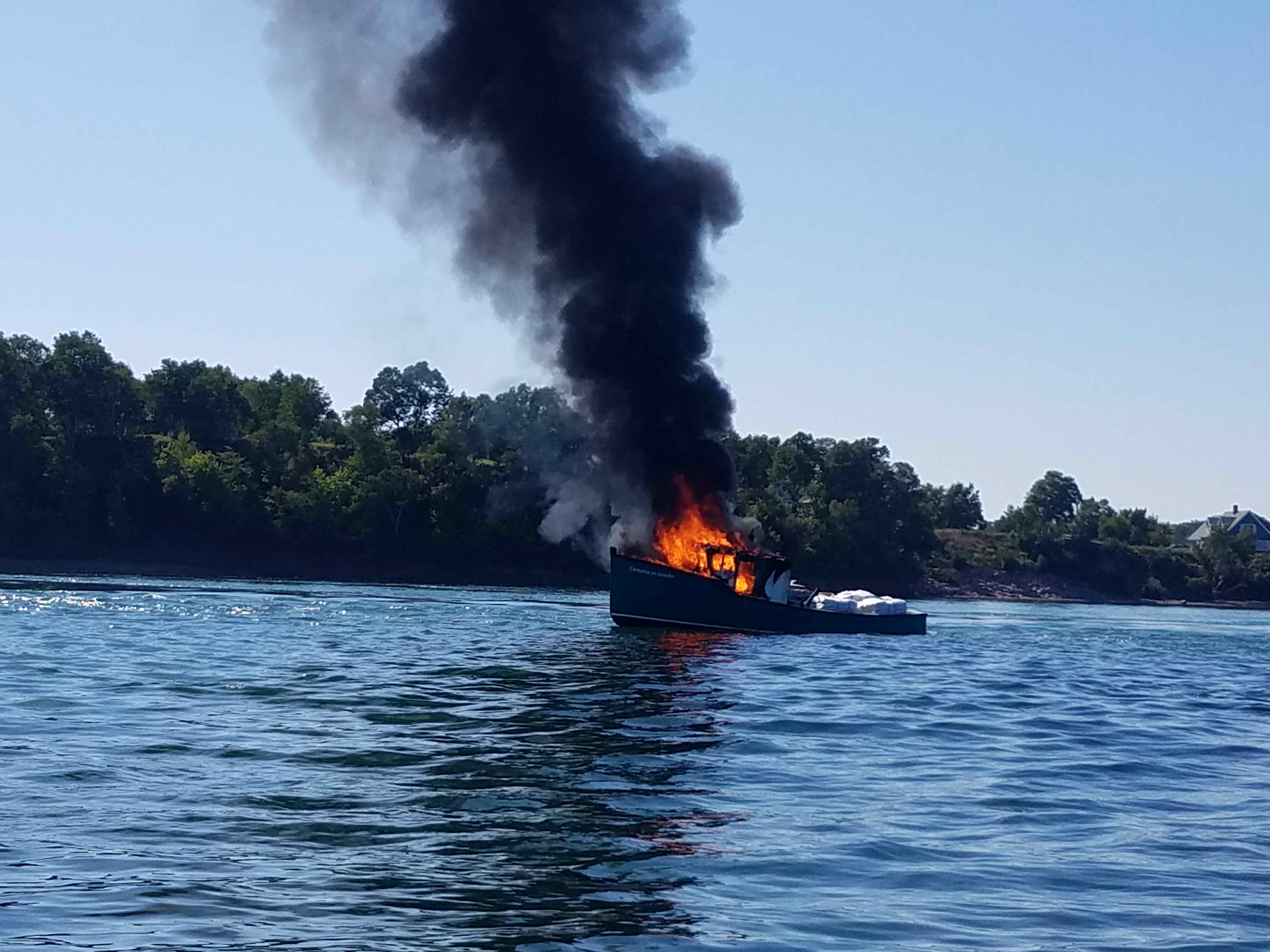 Cooke Aquaculture Employees Rescued in Passamaquoddy Bay After Boat Catches Fire
